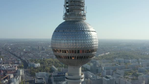 AERIAL: Super Close Up View of the Alexander Platz TV Tower in Berlin, Germany on hot summer day — Αρχείο Βίντεο