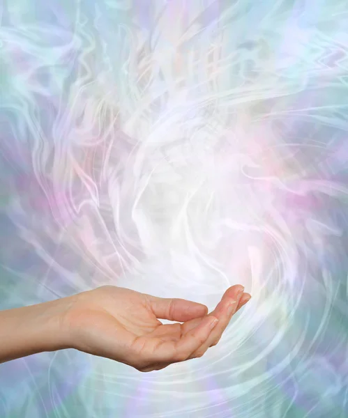 Gently Swirling Cool Healing Energy - Female open palm surrounded by a pale blue and pink energy field with copy space — Stock Image Gently Swirling Cool Healing Energy Female Open Palm Surrounded Pale Royalty Free Stock Photos