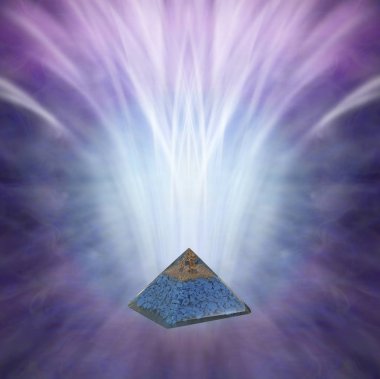 Blue Stone Throat Chakra Orgone Pyramid background - orgone showing blue stone chips relevant to Throat chakra and vibrant energy flowing up and out  with copy space above clipart