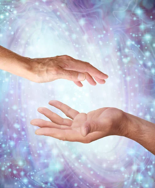 Pure Healing Male and Female yin and yang energy - male hand opposite female hand with a white light orb in between against a purple blue swirling sparkling energy field background — Stock Image Pure Healing Male Female Yin Yang Energy Male Hand Female Royalty Free Stock Images