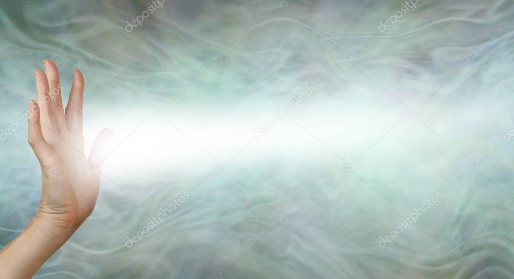 Female Pranic healer sending focused energy from right hand palm chakra -  upright open hand facing out with a stream of white energy flowing horizontally against a pastel green energy field background with copy space