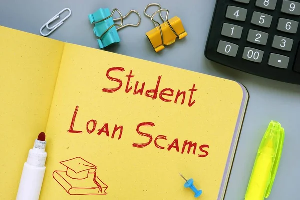 Student Loan Scams  phrase on the piece of paper.