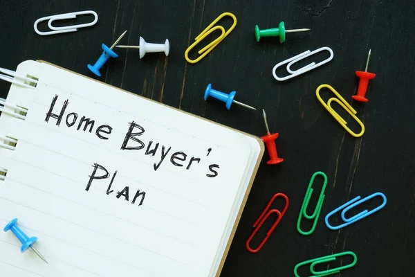 The caption in the picture is Home Buyers\' Plan. Notebook sheet, table, pens.