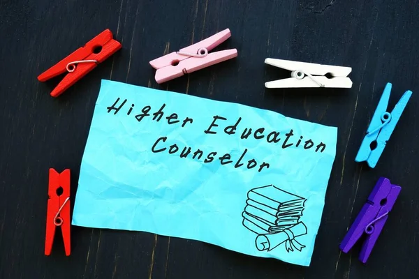Educational concept about Higher Education Counselor with inscription on the sheet.