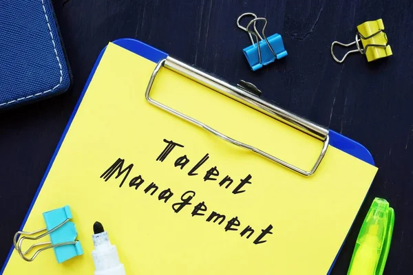 Business concept about Talent Management with sign on the page.