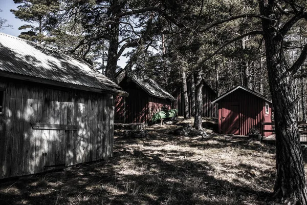 Sweden on the island within the forest with sheds, creepy