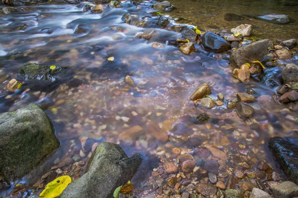 Background Picture of water flows through rocky path of a stream — Stock Photo, Image