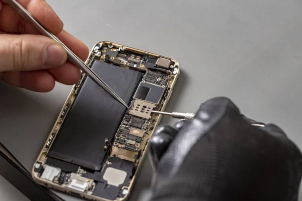 smartphone repair on a work desk