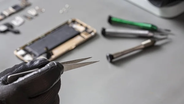 smartphone repair on a work desk