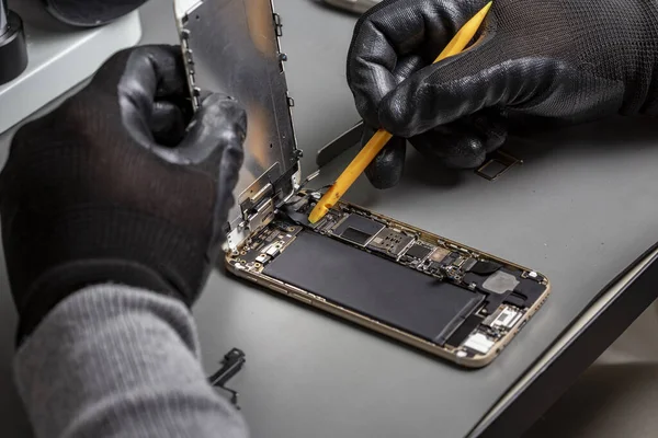 smartphone repair on a work desk