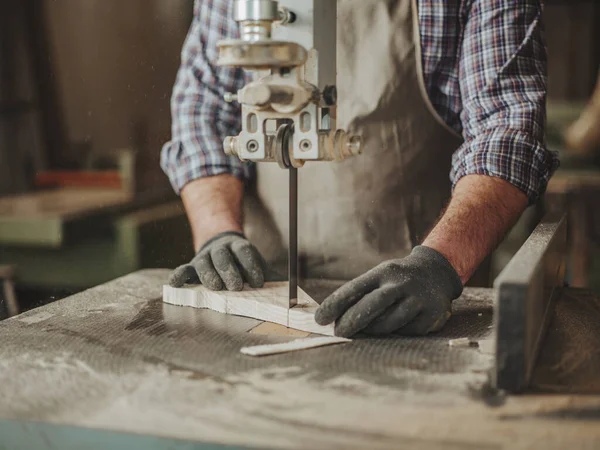 carpenter at work with woodworking tools