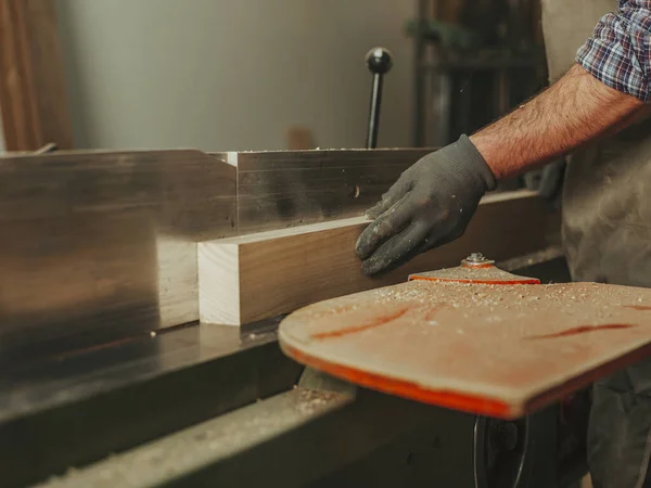 carpenter at work with woodworking tools