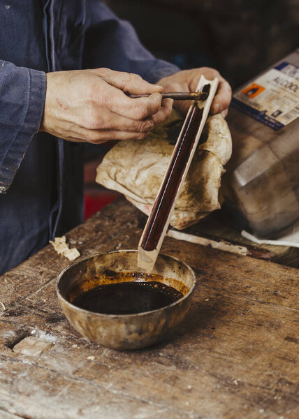 carpenter at work with woodworking tools