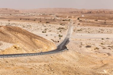 NAGEV, ISRAEL - CIRCA MAY 2018: View of road through the Negev desert circa May 2018 in Nagev. clipart