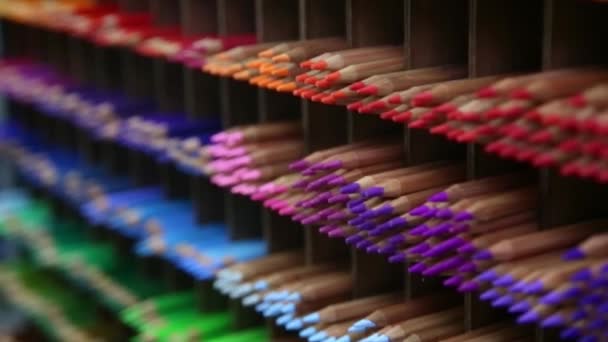 Colored pencils for drawing, lie on shelves — Stock Video
