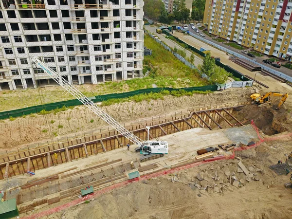 Aerial drone view. Construction site near modern residential area in Kyiv