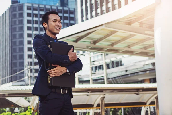 businessman hugging a briefcase, powerful businessman