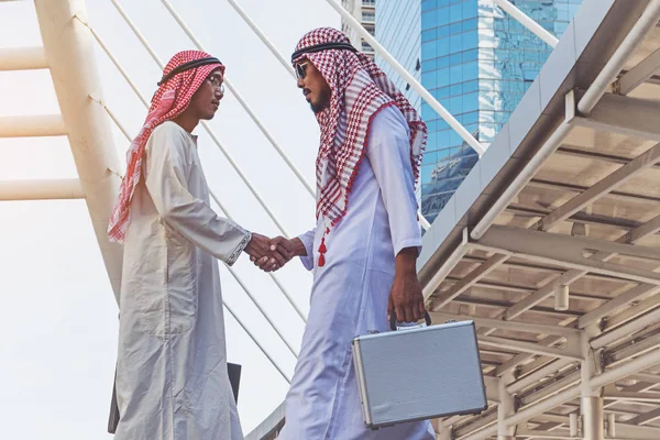Arab businessmen worker handshaking on construction site