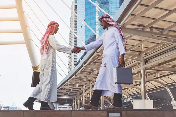 Arab businessmen worker handshaking on construction site