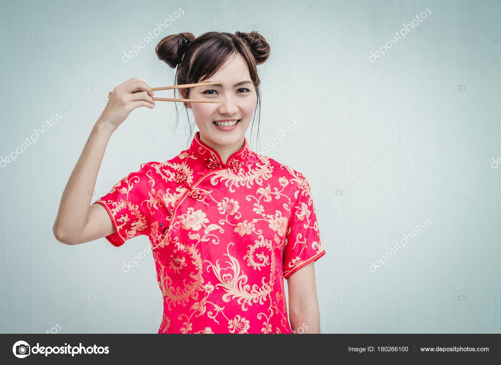Young Chinese Woman Holding Chopsticks Stock Photo C Zenstock