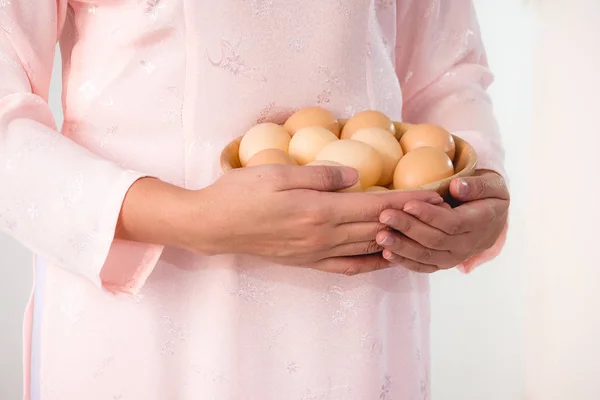 beautiful woman vietnamese holding eggs