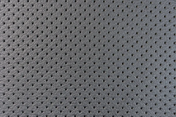 Textura de couro com pequenos buracos negros, fundo abstrato — Fotografia de Stock