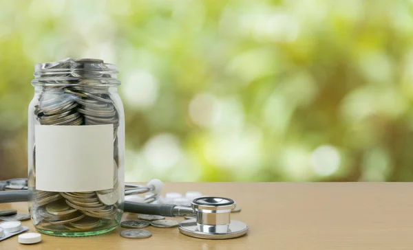 money saving for medical in the glass bottle for money concept