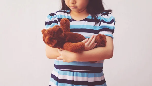 Asia girl hugging a teddy bear — Stock Photo, Image