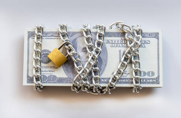 Dollar bills with chain and padlock, Safety money and investment concept.