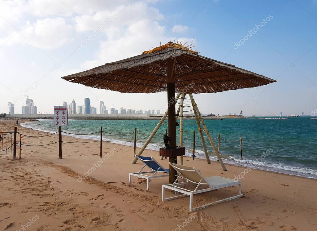 Empty beach in Doha, Qatar closed to combat the spread of the COVID-19 coronavirus. Long beach and nobody on it. No people, no tourists