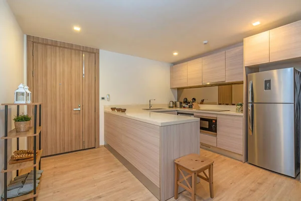 Modern and build-in kitchen in apartment and villa feature refrigerator, oven, hood and kitchenette