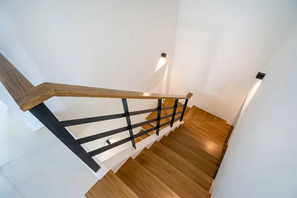 Wooden staircase with lighting in modern house, villa and penthouse