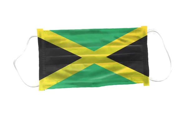 带牙买加国旗图案白色背景的医用口罩 用于Corona或Covid 19病毒 用于病毒变异的安全呼吸口罩 健康保护概念 鼻罩以防止病毒 — 图库照片