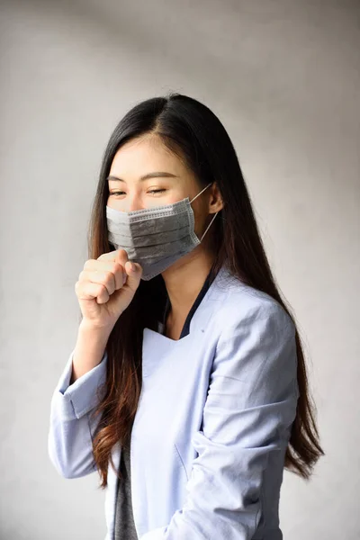 Asian woman wear face mask, coughing with wear mask for virus protection, corona virus,covid-19 virus pandemic concept