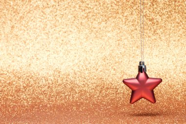 Glitter arka plan üzerinde küçük Noel Kızılyıldız