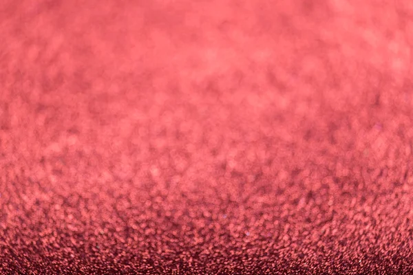 Defocused red glitter background