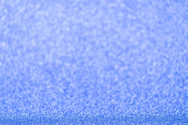 Defocused blue glitter background