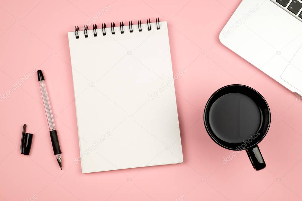 Minimal flat lay style picture of blank notebook page with diffe