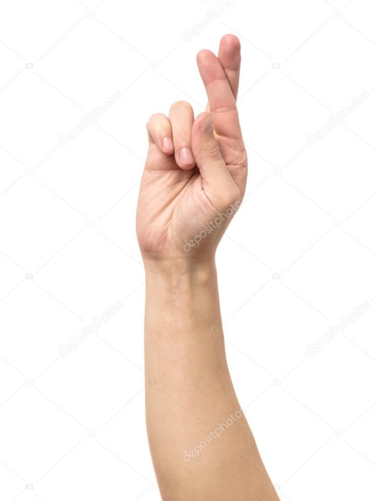 Gesturing good luck symbol fingers