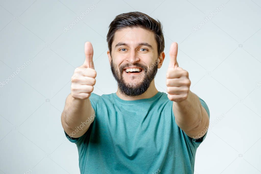 Happy man giving thumbs up sign