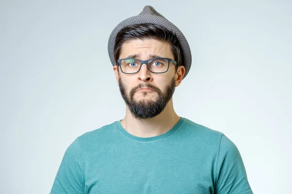Portrait of young man with sad face expression — Stock Photo, Image