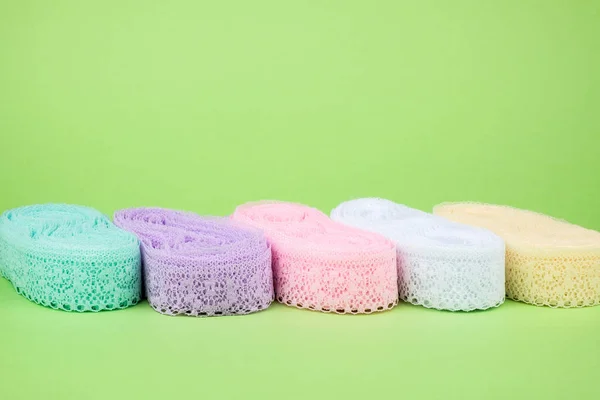 Closeup of ribbon roll over colorful background — Stock Photo, Image