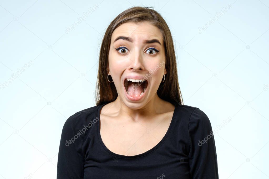 Beautiful young woman with a fear expression