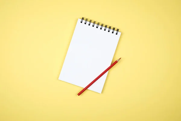 Blank writing pad for ideas on colored background