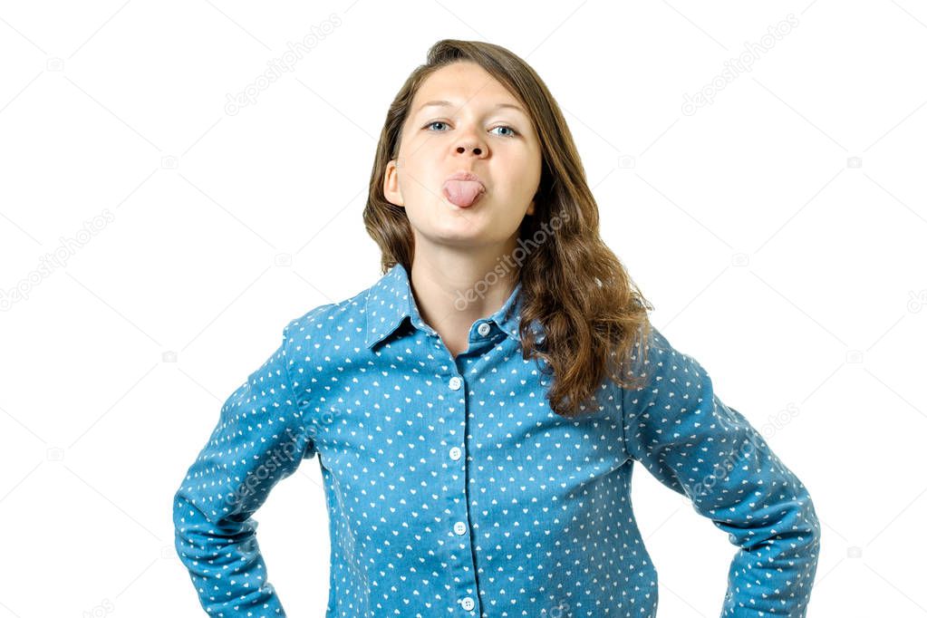 Cheerful lovely girl showing her tongue out