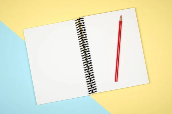 Blank writing pad for ideas on colored background