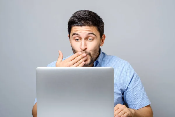 Happy young man video chatting on laptop computer — Stock Photo, Image