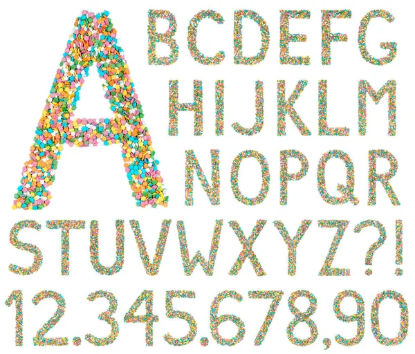 Letras del alfabeto inglés, números y símbolos hechos de poco ca — Foto de Stock