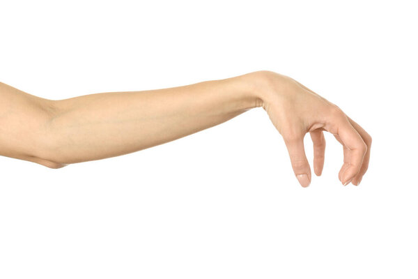 Hand picking, holding, grabbing or reaching. Woman hand with french manicure gesturing isolated on white background. Part of series