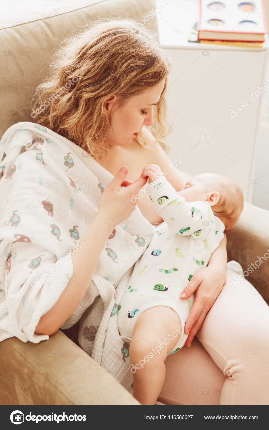 Young Beautiful Blonde Mother Breastfeeding Her Stock Photo